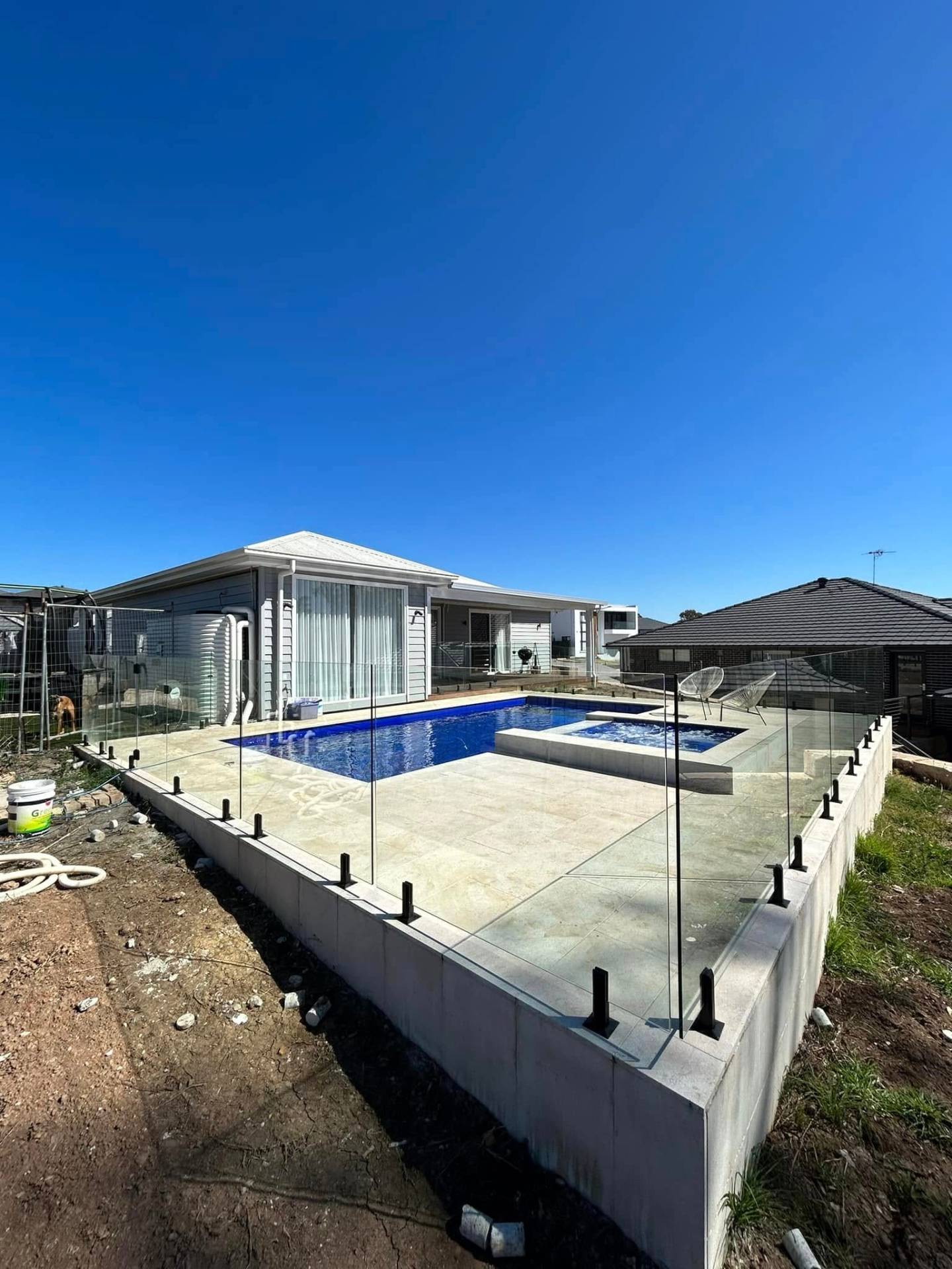 Frameless glass pool fence on a Sydney backyard pool
